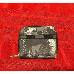 EUC LeSportsac Wallet in black lace print. The perfect size for smaller handbags